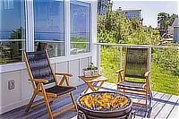 Gas fire pit with chairs on the outdoor deck